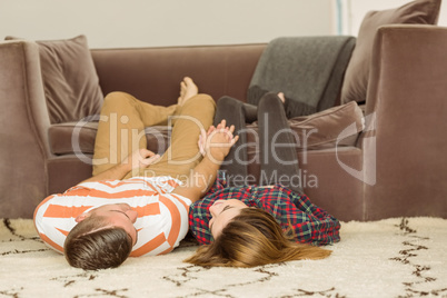 Cute couple lying on floor