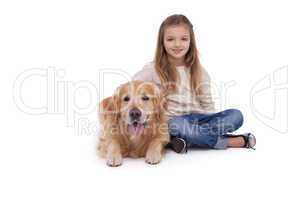 Girl sitting beside her pet dog