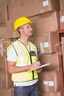 Warehouse worker with clipboard