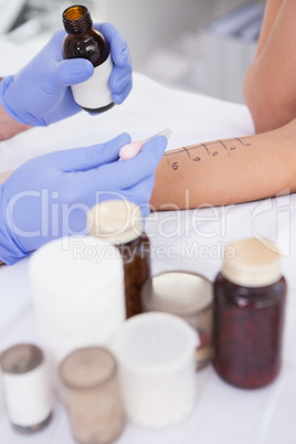 Doctor carrying out a skin prick test