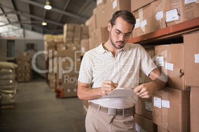 Warehouse worker with clipboard