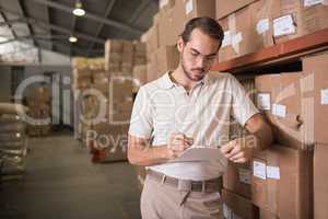 Warehouse worker with clipboard