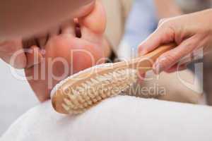 Customer getting pedicure at nail salon