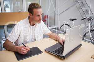 Man using graphics tablet to do work