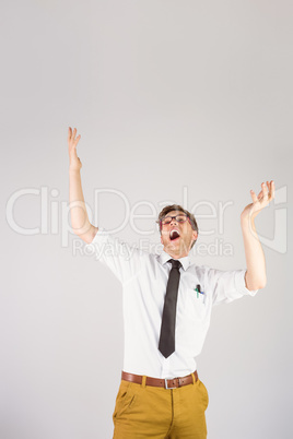 Geeky businessman standing with arms raised