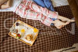 Cute couple having breakfast in bed