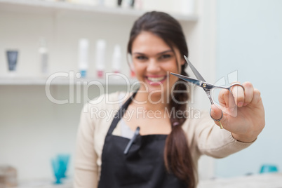 Cheerful hairdresser looking at camera