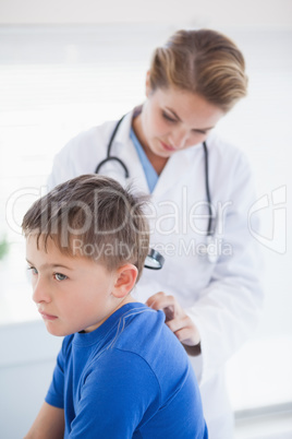 Doctor examining a patients neck Doctor examining a patients neck