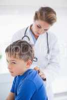 Doctor examining a patients neck