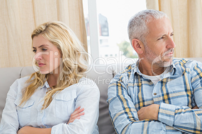 Couple arguing on the couch Couple arguing on the couch