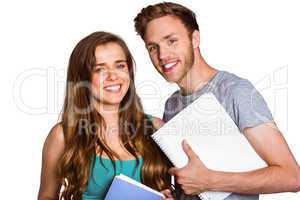 Smiling young couple with books