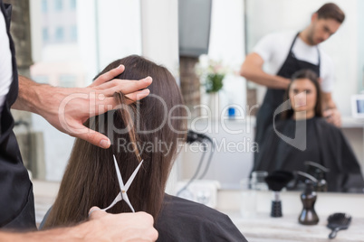 Pretty brunette getting her hair cut