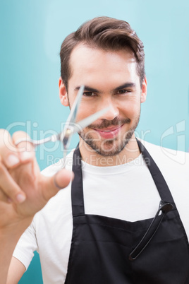 Handsome hair stylist looking at camera