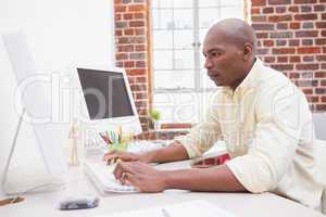 Casual businessman working at his desk