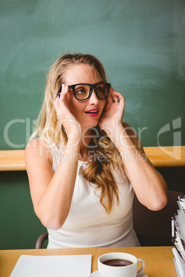 Beautiful young businesswoman at desk