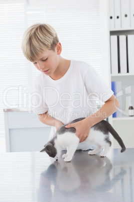 Smiling owner holding his cat