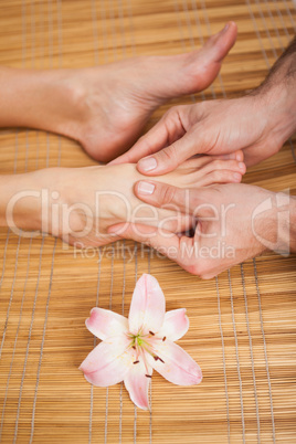 Pedicurist massaging a customers foot