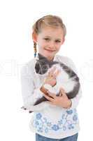 Smiling little girl with her cute kitten