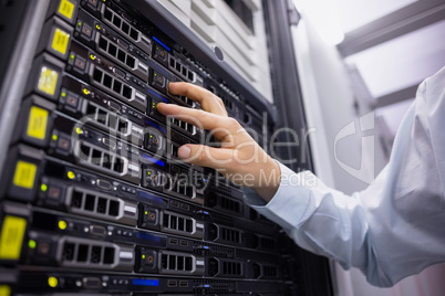 Technician working on server tower