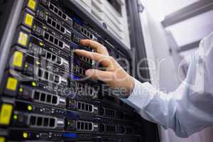Technician working on server tower