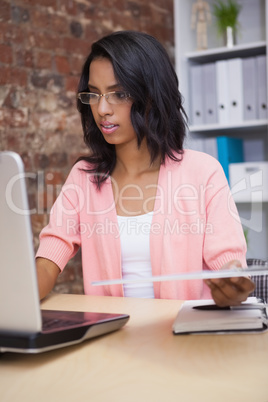 Attractive businesswoman on her laptop