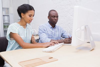 Business team working together on laptop