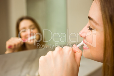 Cute couple brushing their teeth