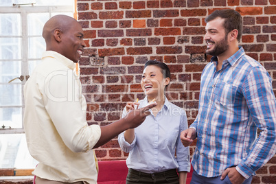 Casual business team talking and laughing