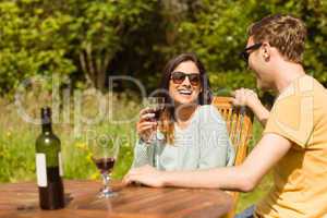 Young couple enjoying red wine