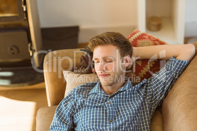 Young man napping on his couch