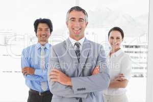 Businessman standing with work colleagues