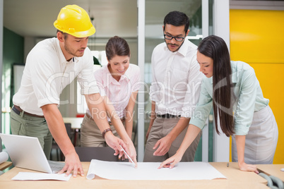 Architecture team working together at desk