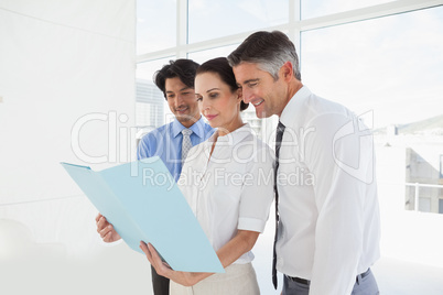 Business team looking over files