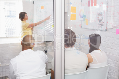 Business team sitting while listening to a colleague