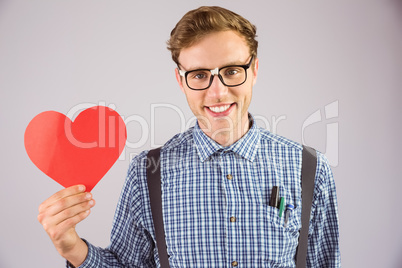 Geeky hipster holding a heart card