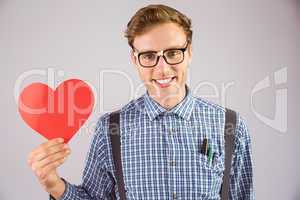 Geeky hipster holding a heart card