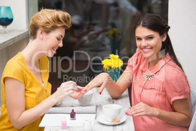 Pretty friends having a coffee