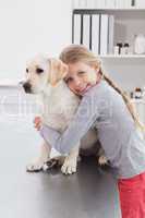 Happy owner hugging her cute dog
