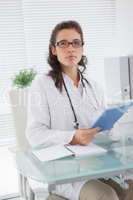 Vet sitting and holding tablet