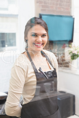 Hair stylist smiling at camera