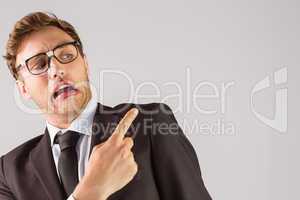 Young geeky businessman pointing to shoulder