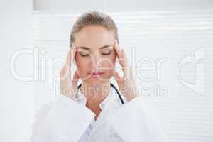 Doctor suffering from a migraine