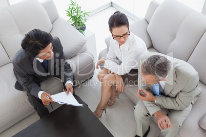 Business team discussing meeting notes