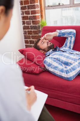 Depressed patient lying on couch