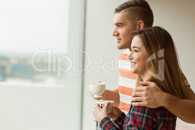 Cute couple looking out the window