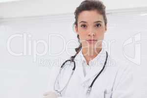 Concentrated doctor standing with stethoscope