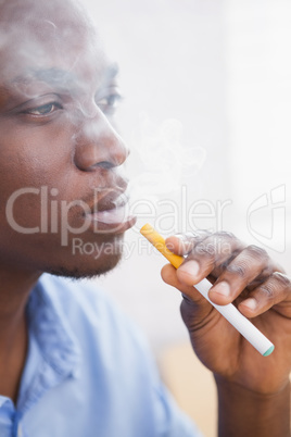 Businessman smoking an electronic cigarette