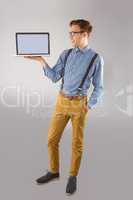 Geeky businessman showing his laptop