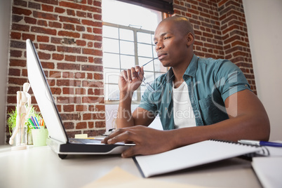 Casual businessman working at his desk