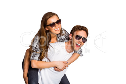 Smiling young man carrying woman Smiling young man carrying woman